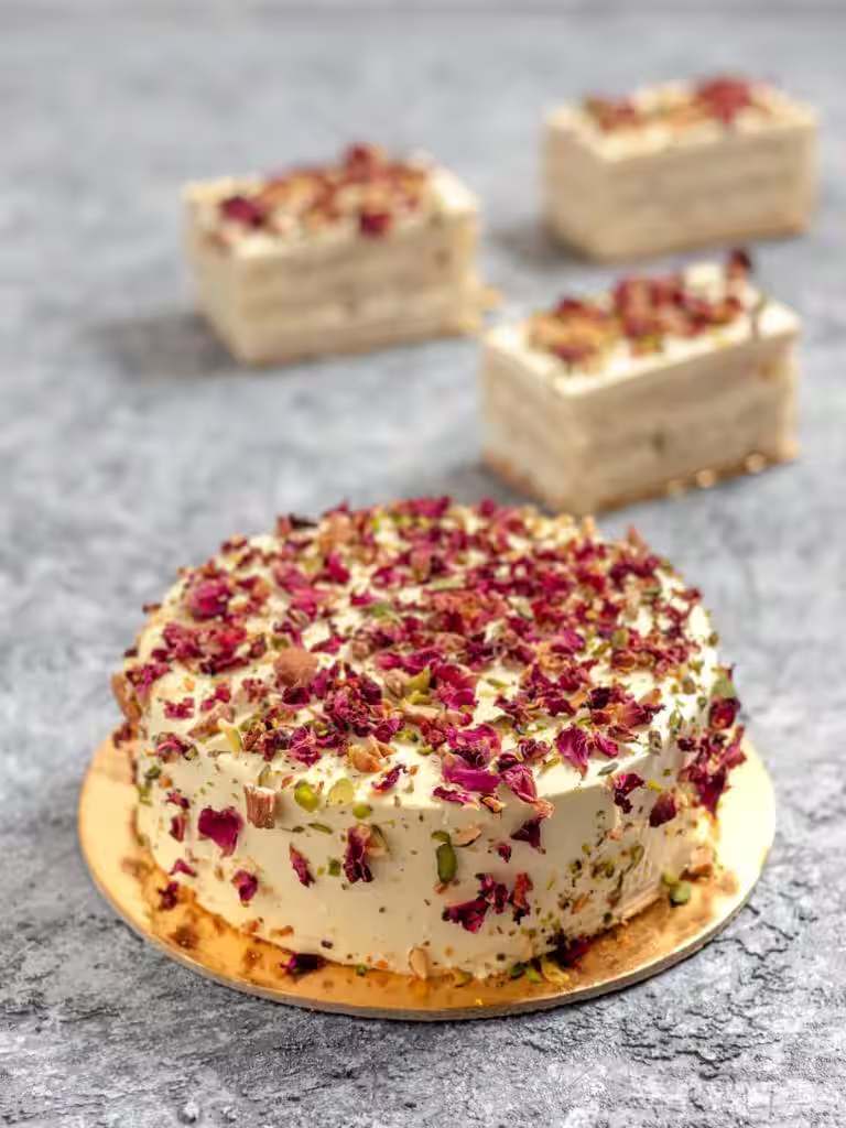 Rose petal cheesecakes on a gold board